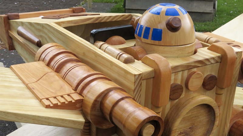 Illustration for article titled This Exquisite Wooden X-wing Rocker Will Make You Miss Being a Kid